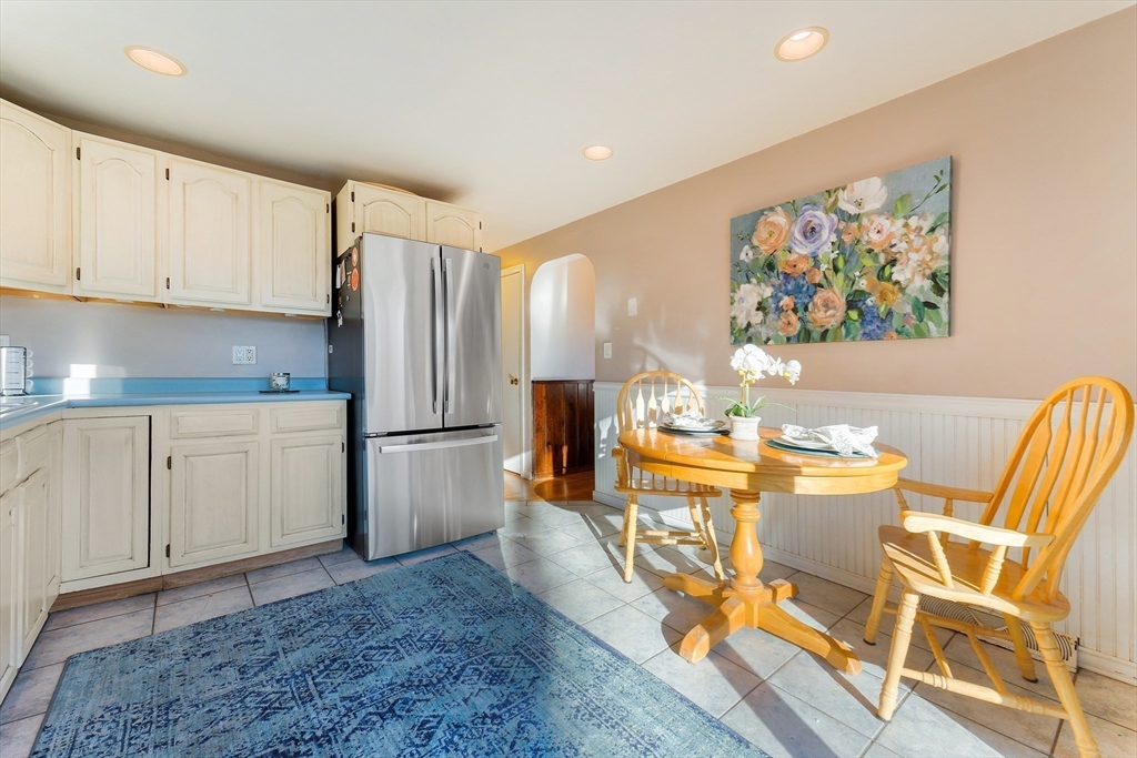 3 Riverside Road Billerica, MA 01821 - Photo 10 of 42 a view of a kitchen with fridge and wooden floor