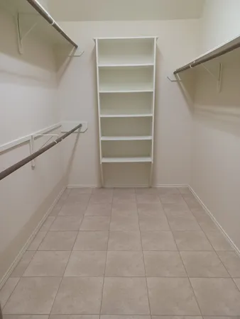 a view of an empty walk in closet
