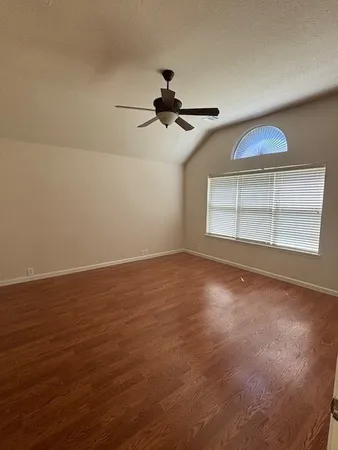 a view of an empty room with a window