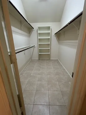 a view of an empty walk in closet