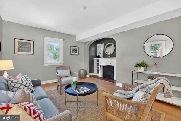 a living room with furniture a couch and a fireplace