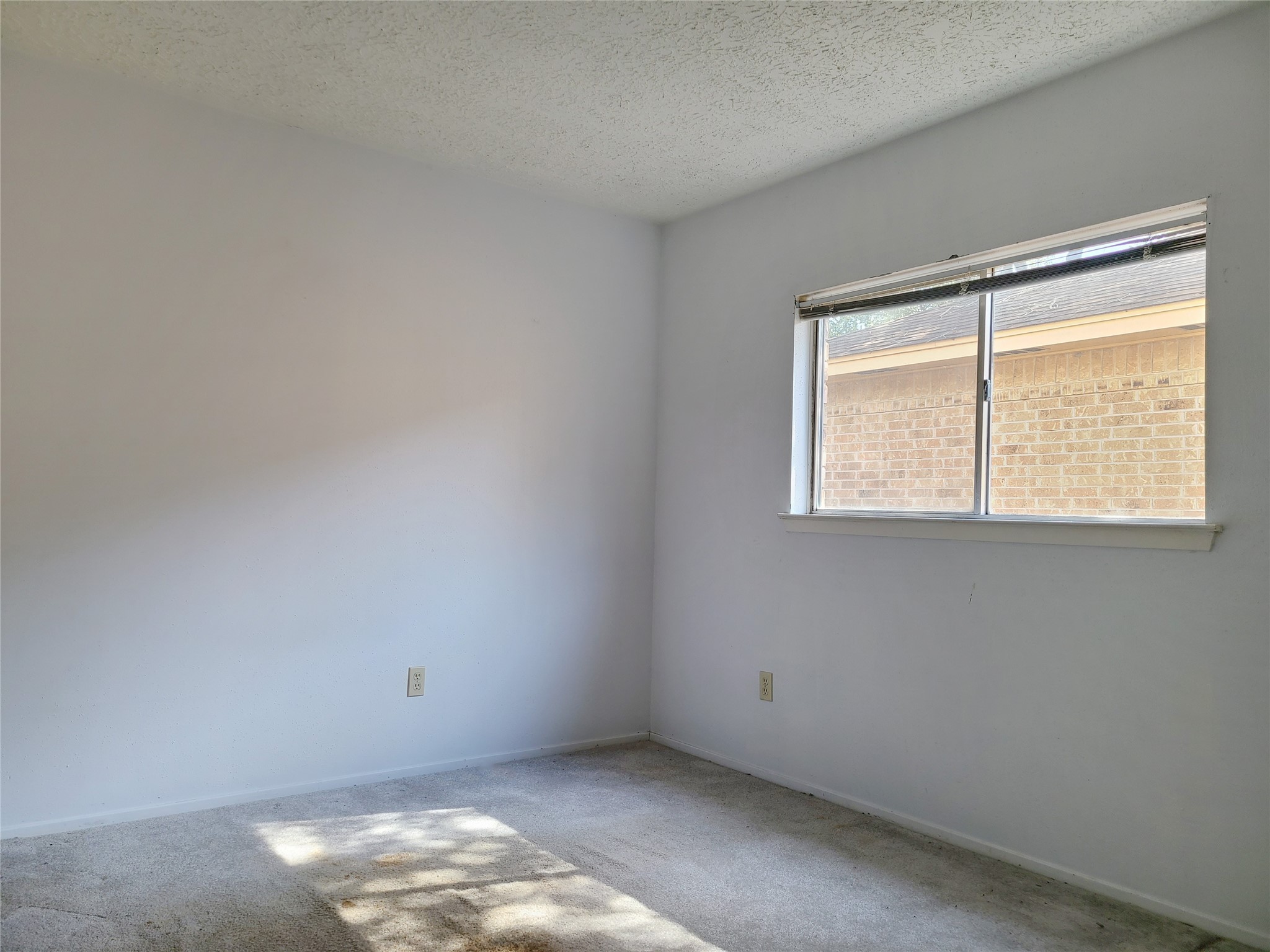 24127 Spring Towne Drive Spring, TX 77373 - Photo 11 of 20 an empty room with a window