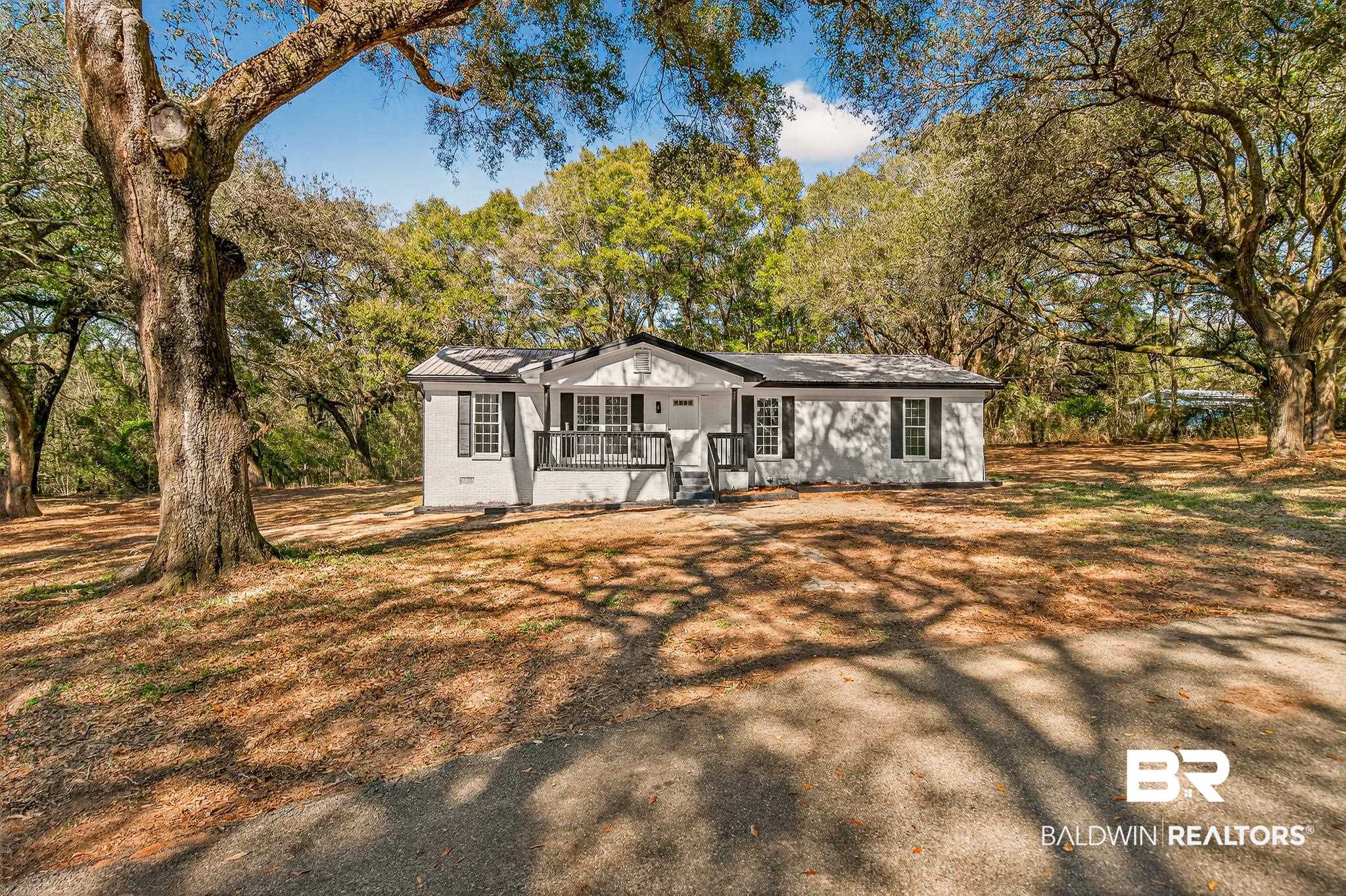 10650 Old Pascagoula Road Theodore, AL 36582 - Photo 3 of 77 Ranch-style house featuring view of scattered trees