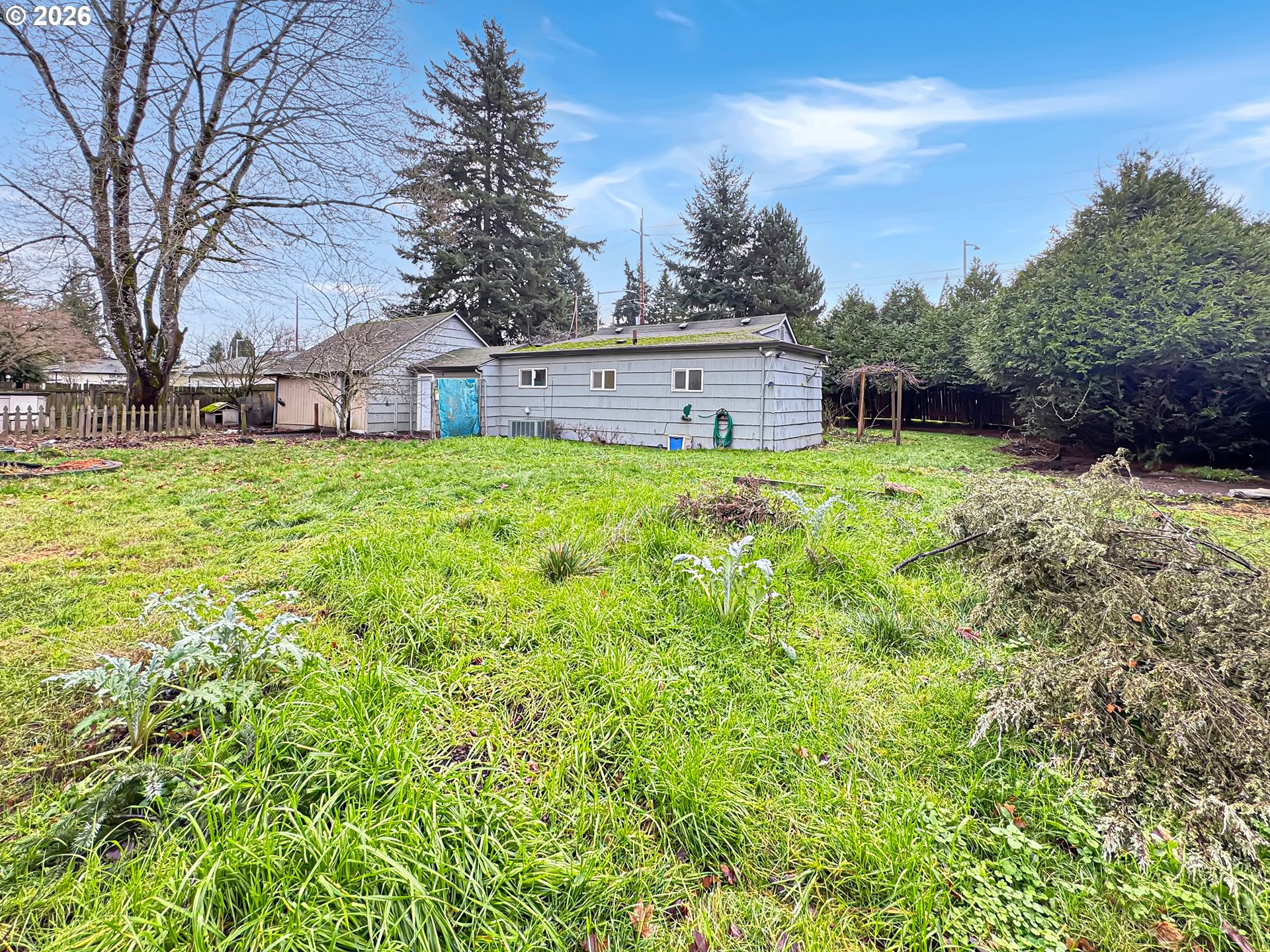 9310 Northeast Burton Road Vancouver, WA 98662 - Photo 17 of 24 a view of backyard of house with green space