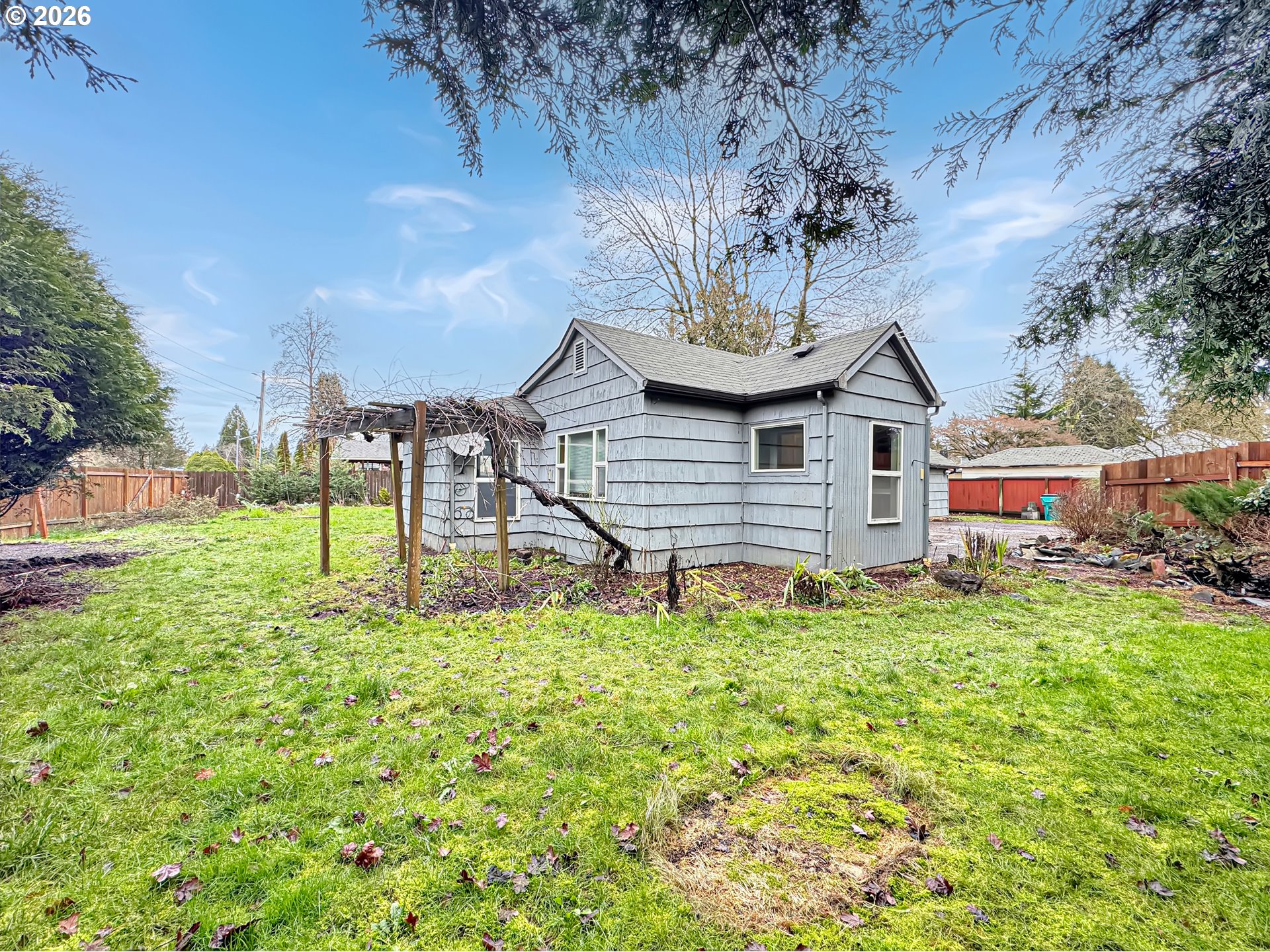 9310 Northeast Burton Road Vancouver, WA 98662 - Photo 18 of 24 a front view of a house with a yard