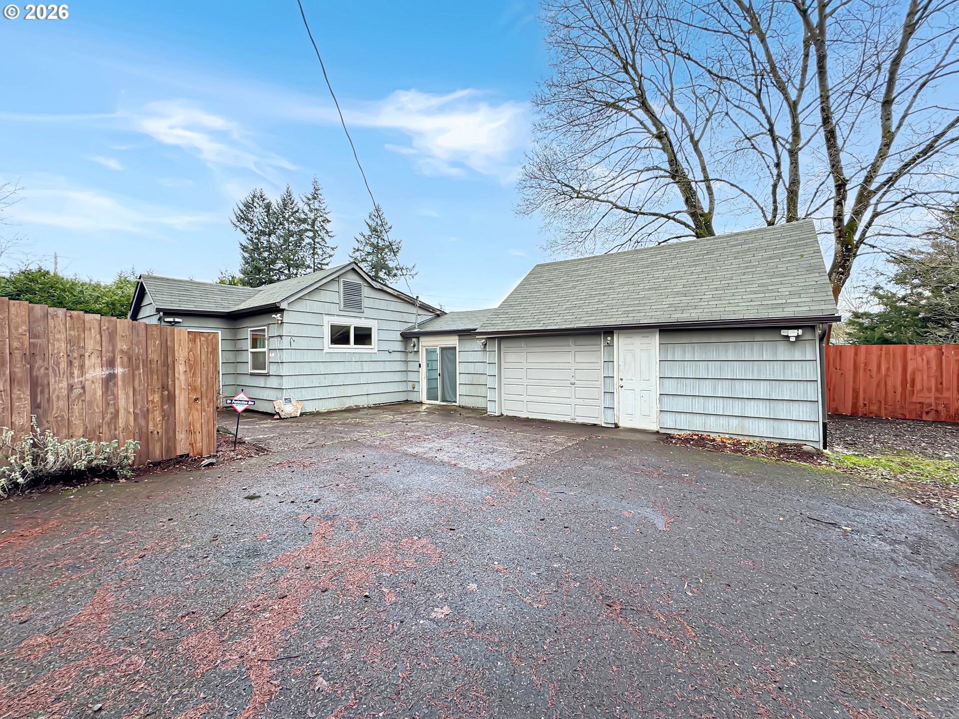9310 Northeast Burton Road Vancouver, WA 98662 - Photo 24 of 24 a view of a house with a backyard and a garage