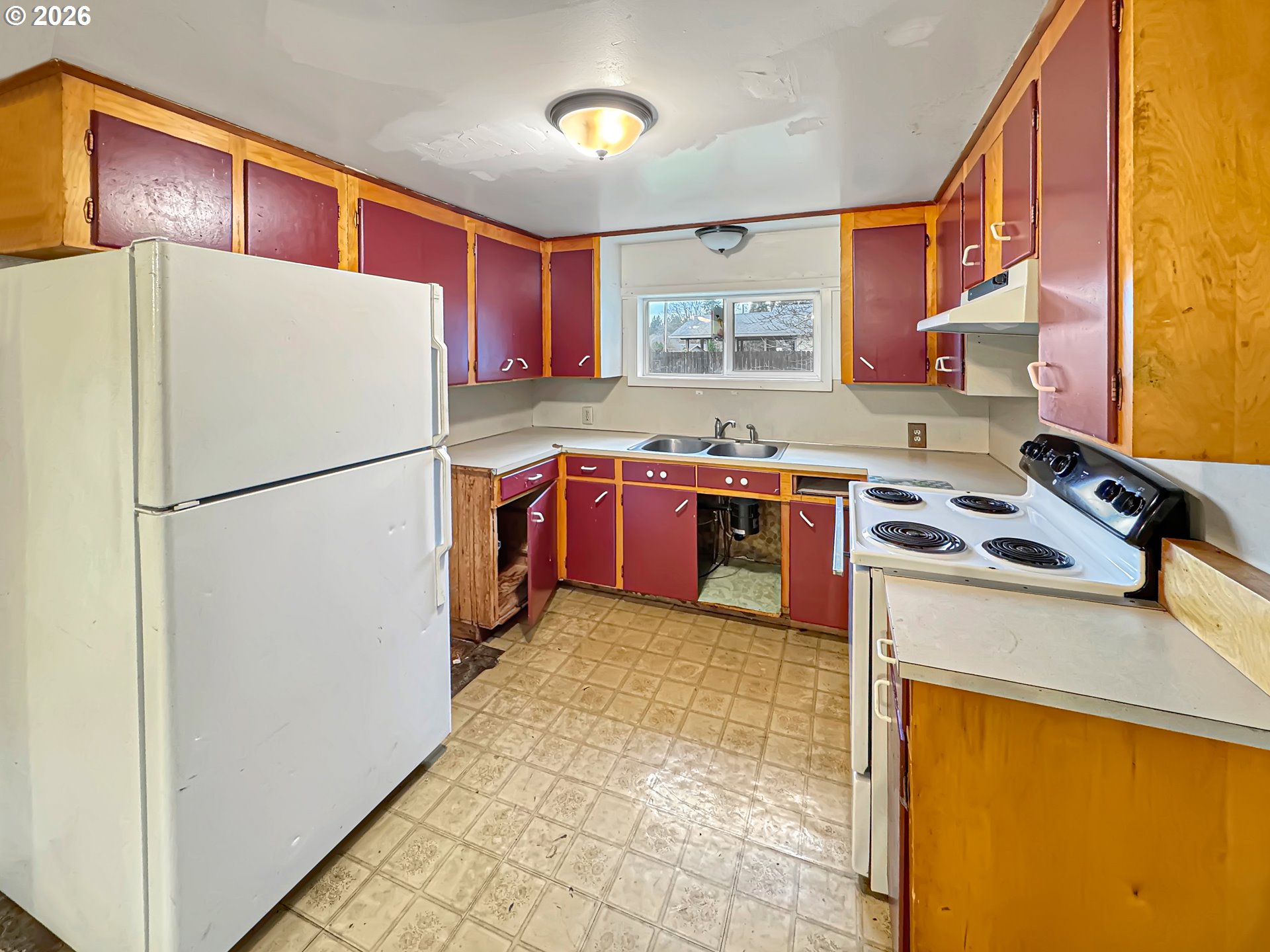 9310 Northeast Burton Road Vancouver, WA 98662 - Photo 6 of 24 a kitchen with stainless steel appliances granite countertop a stove a refrigerator and a sink