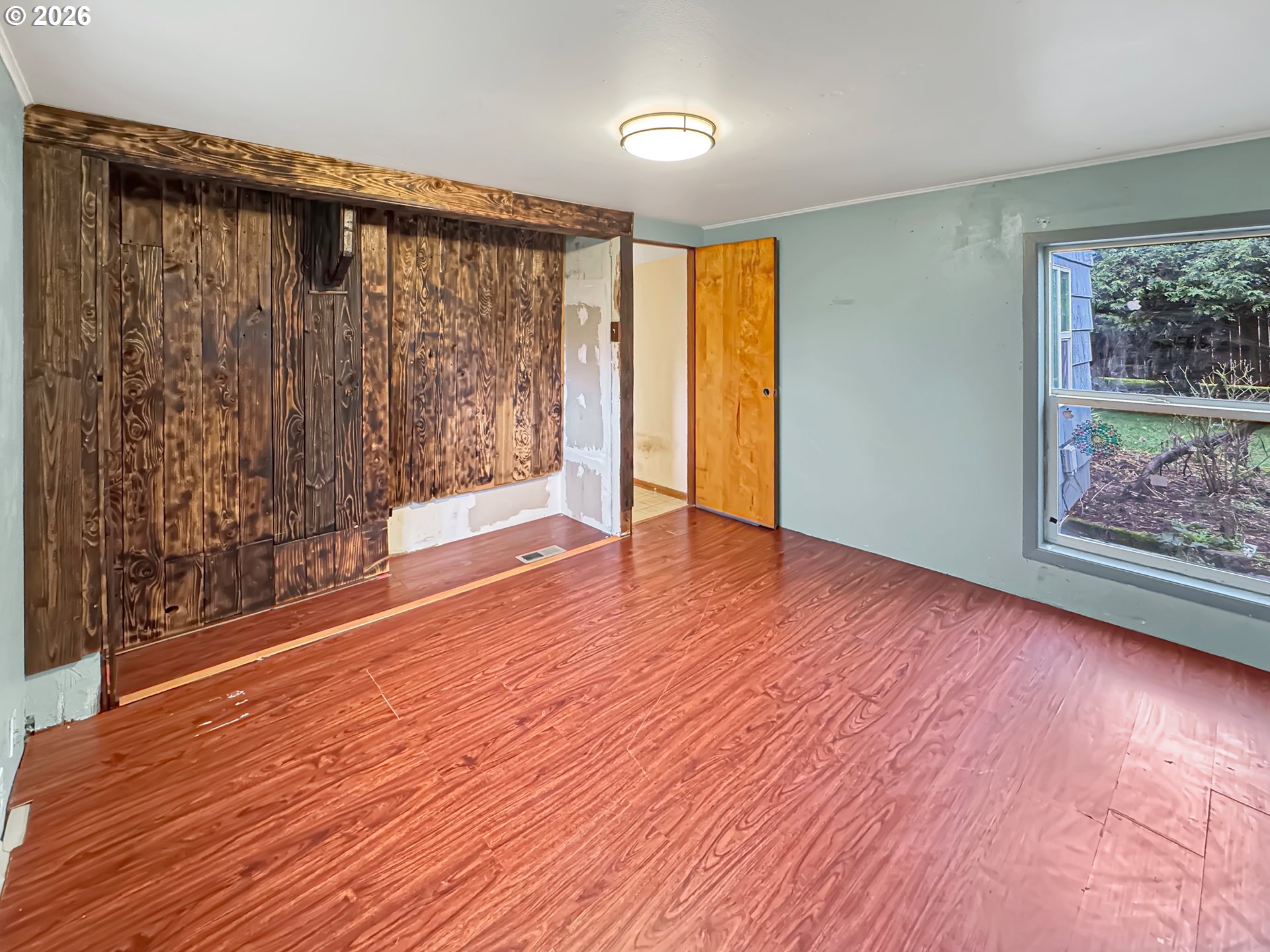 9310 Northeast Burton Road Vancouver, WA 98662 - Photo 8 of 24 a view of empty room with wooden floor and fan