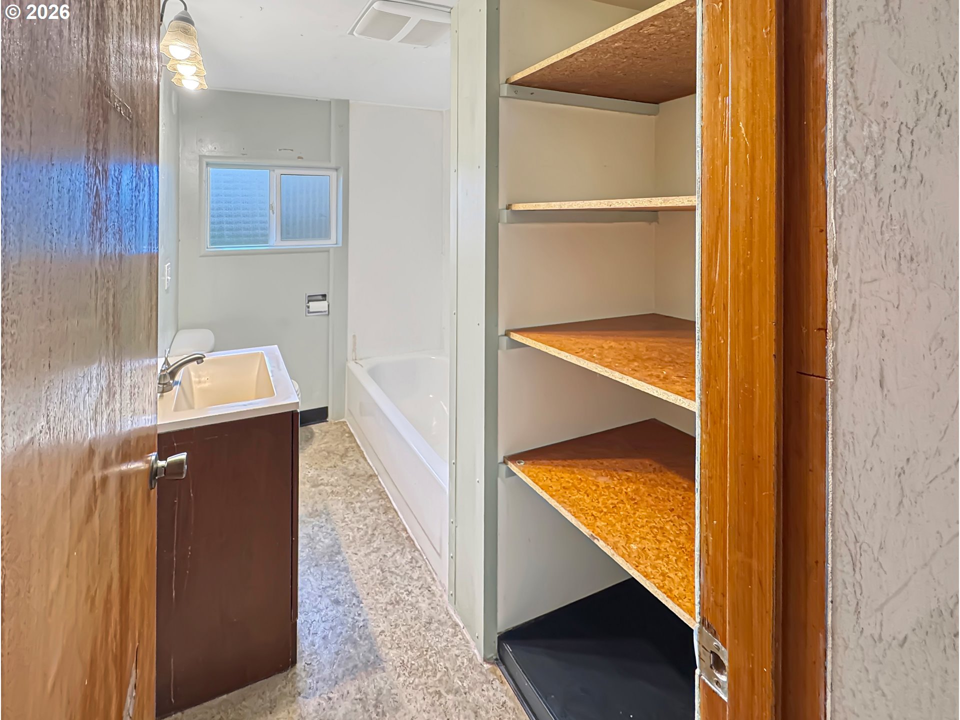 9310 Northeast Burton Road Vancouver, WA 98662 - Photo 9 of 24 a view of walk in closet with wooden floor