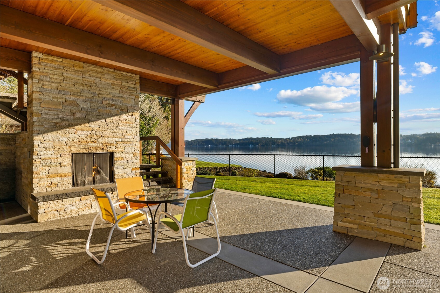 560 Cronquist Road Allyn, WA 98524 - Photo 32 of 39 a view of a patio with table and chairs