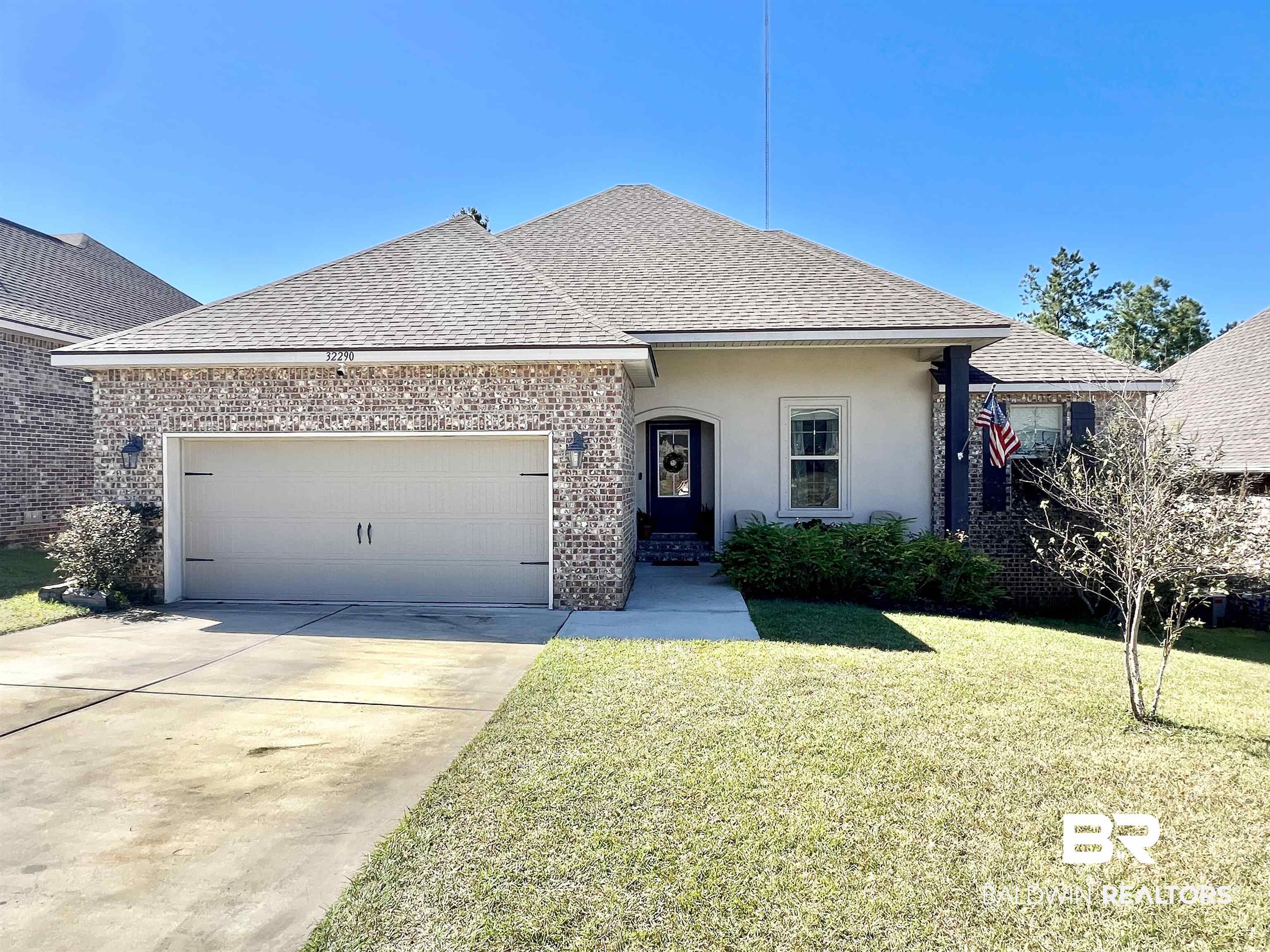 32290 Calder Court Daphne, AL 36527 - Photo 2 of 59 View of front of home with a front lawn and a garage