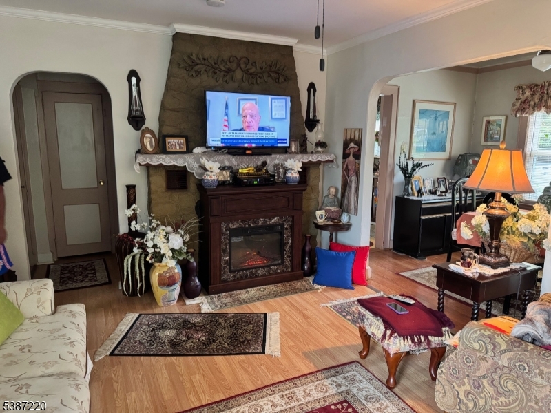 8 Hopatcong Street Hopatcong, NJ 07821 - Photo 12 of 22 a living room with furniture and a fireplace