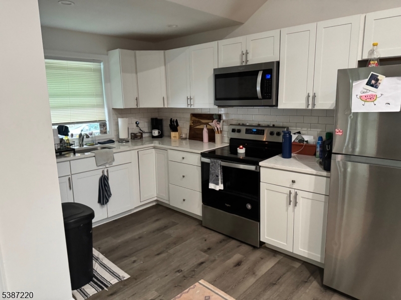 8 Hopatcong Street Hopatcong, NJ 07821 - Photo 14 of 22 a kitchen with white cabinets and appliances