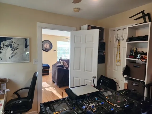 a bedroom with furniture and a window