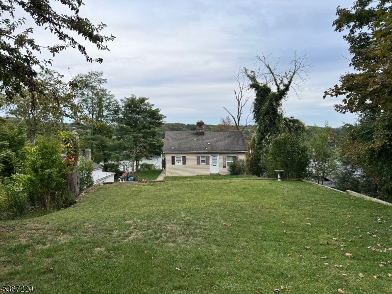 8 Hopatcong Street Hopatcong, NJ 07821 - Photo 5 of 22 a view of a house with a big yard and large trees