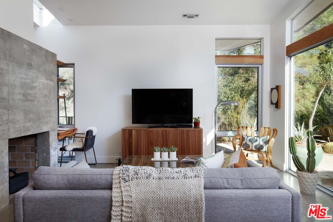 7500 Devista Drive Los Angeles, CA 90046 - Photo 15 of 43 a living room with furniture and a flat screen tv