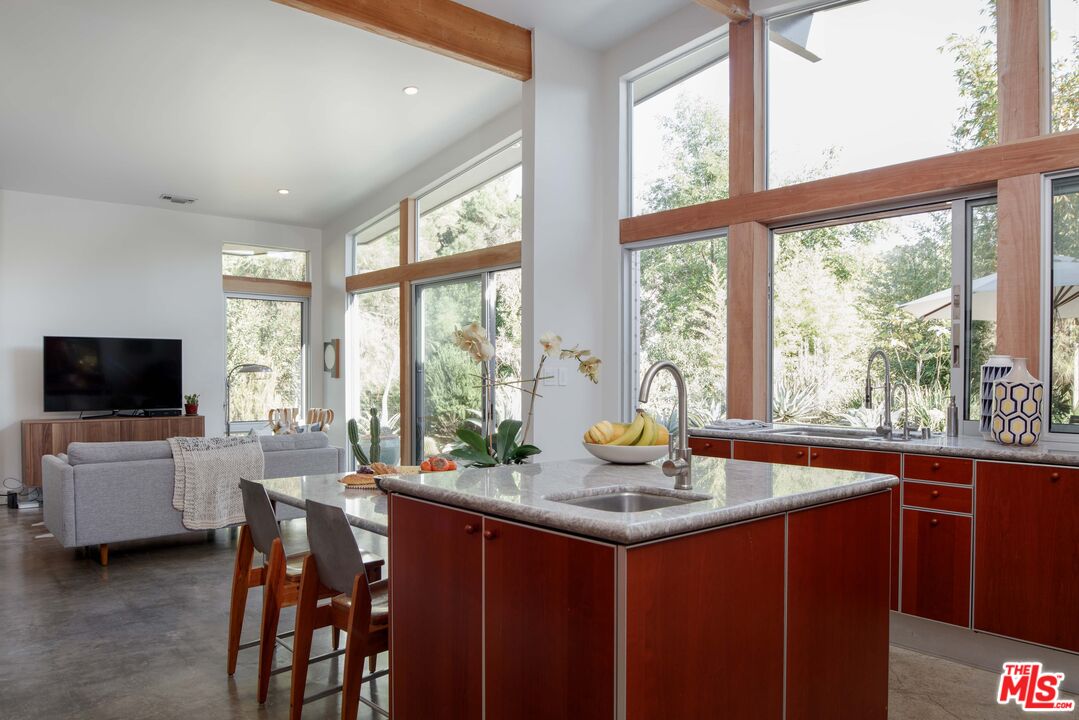 7500 Devista Drive Los Angeles, CA 90046 - Photo 20 of 43 a dining room with a large window and table