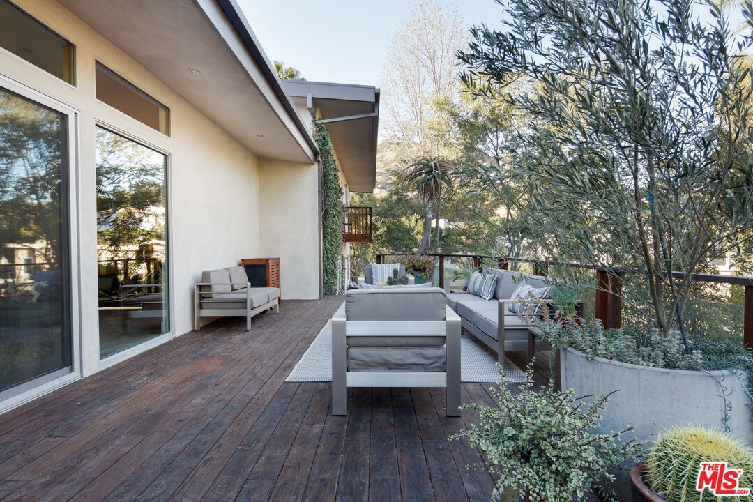 7500 Devista Drive Los Angeles, CA 90046 - Photo 21 of 43 a view of a patio with couches and potted plants