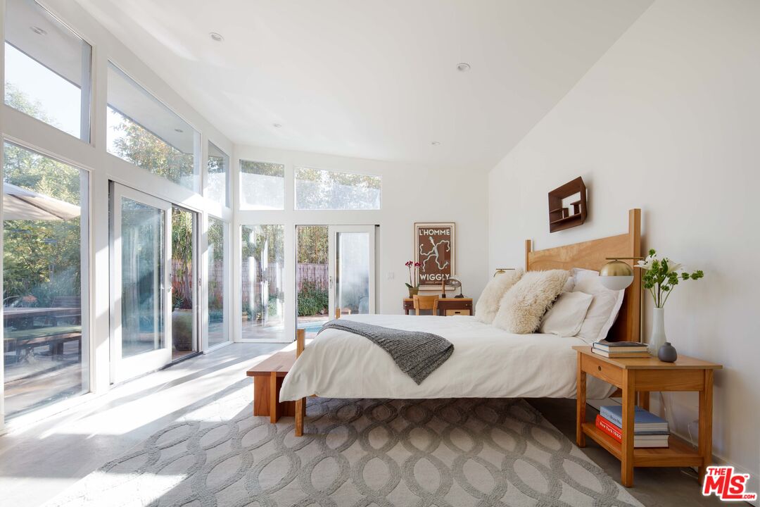 7500 Devista Drive Los Angeles, CA 90046 - Photo 24 of 43 a bedroom with a bed and a window