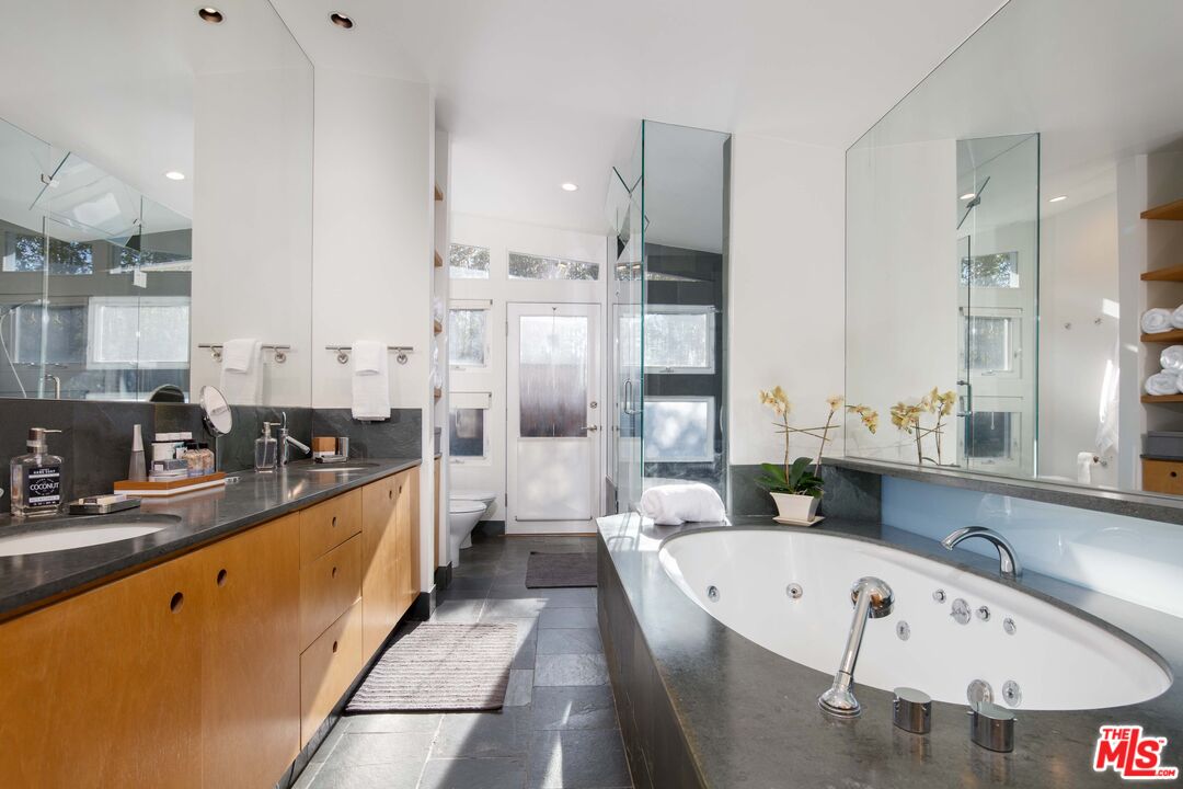 7500 Devista Drive Los Angeles, CA 90046 - Photo 25 of 43 a large white kitchen with a large window and stainless steel appliances