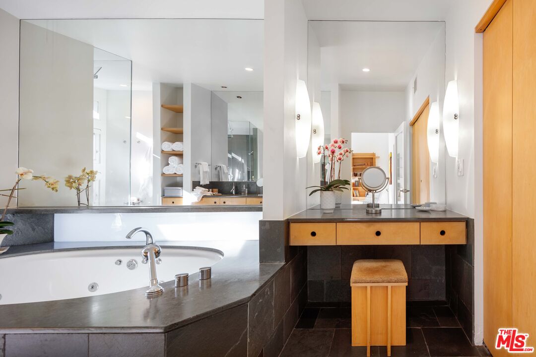 7500 Devista Drive Los Angeles, CA 90046 - Photo 26 of 43 a kitchen with kitchen island a sink appliances and a counter top space