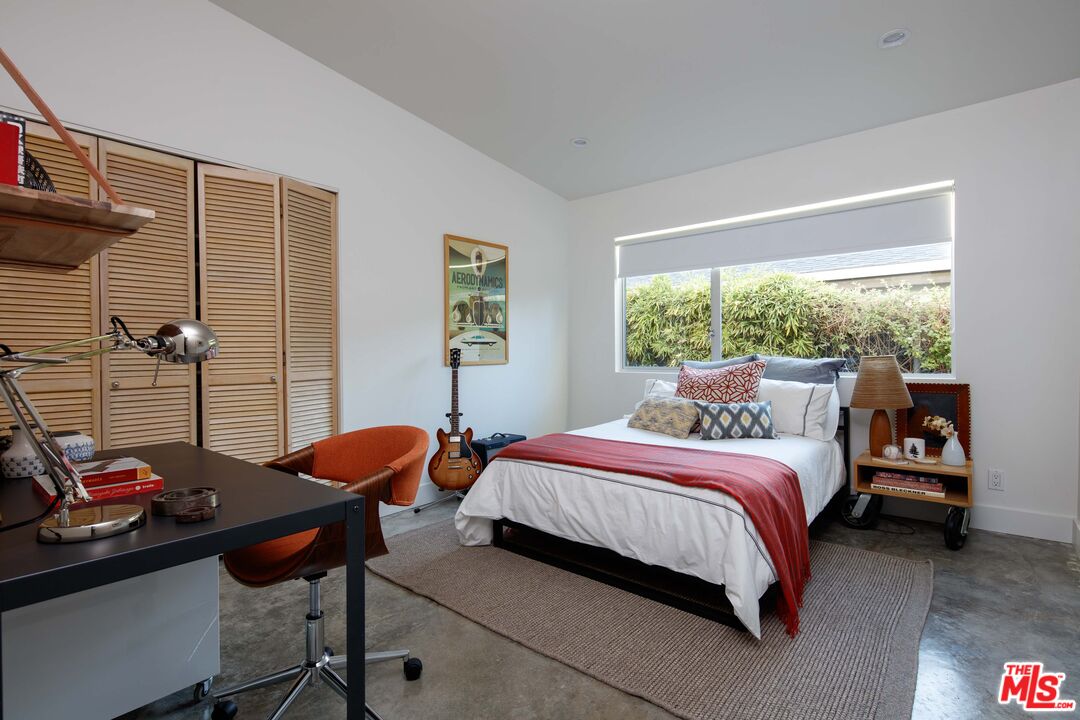 7500 Devista Drive Los Angeles, CA 90046 - Photo 29 of 43 a bedroom with a bed and a window