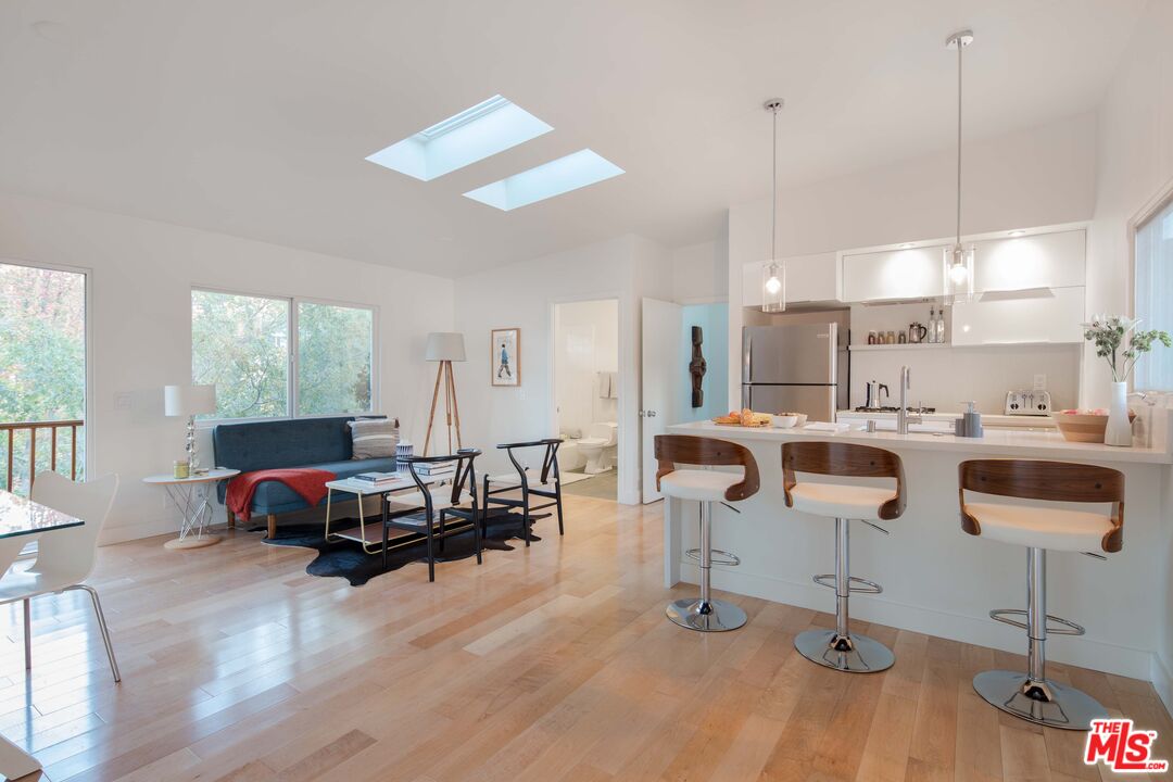 7500 Devista Drive Los Angeles, CA 90046 - Photo 33 of 43 a living room with lots of furniture and kitchen view