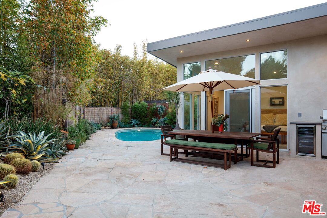 7500 Devista Drive Los Angeles, CA 90046 - Photo 37 of 43 a view of a house with backyard and sitting area