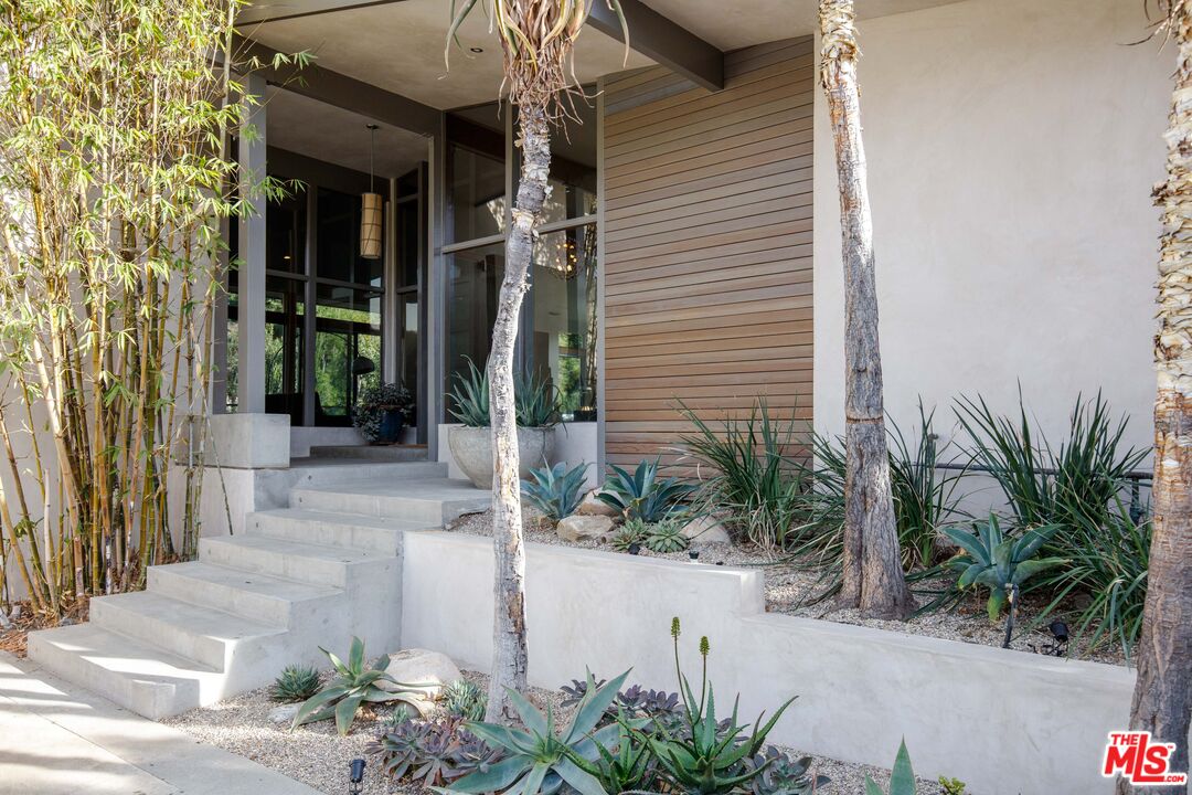 7500 Devista Drive Los Angeles, CA 90046 - Photo 5 of 43 a front view of a house with a yard