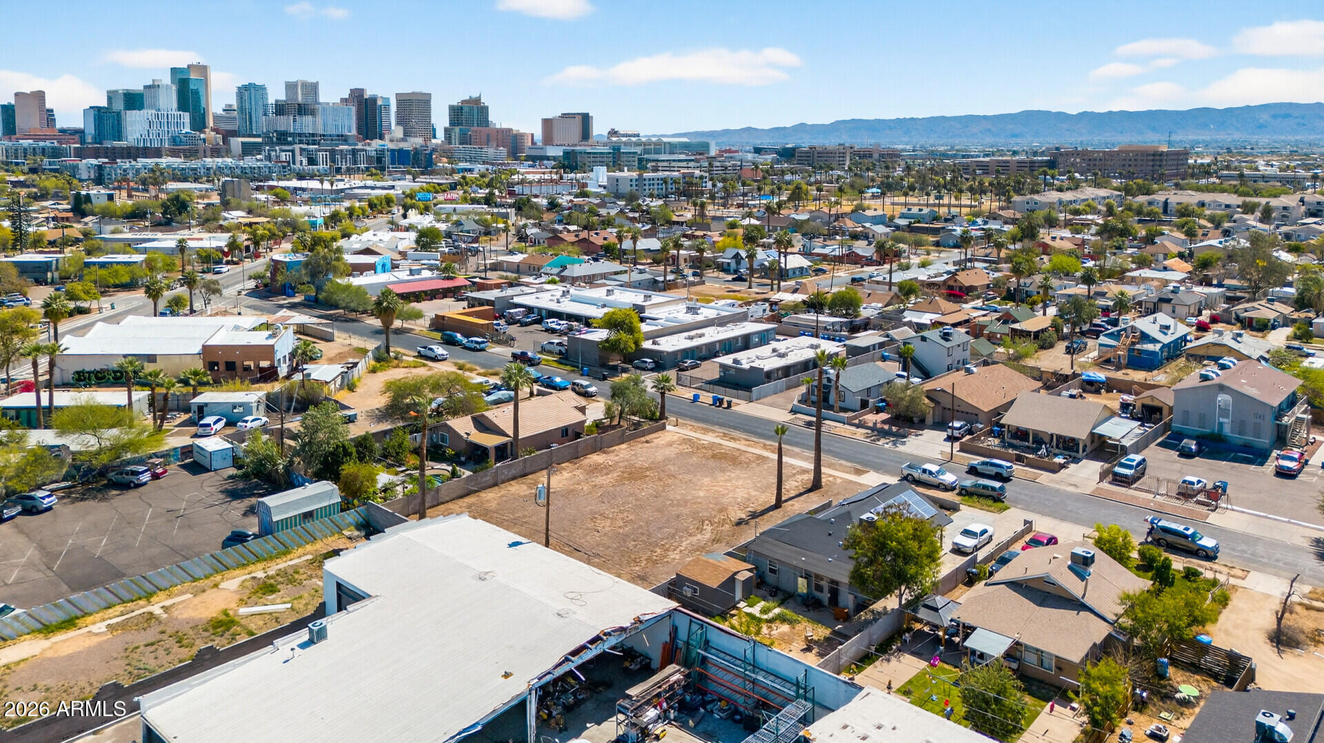 1244 West Pierce Street Phoenix, AZ 85007 - Photo 8 of 31 an aerial view of a city with lots of residential buildings
