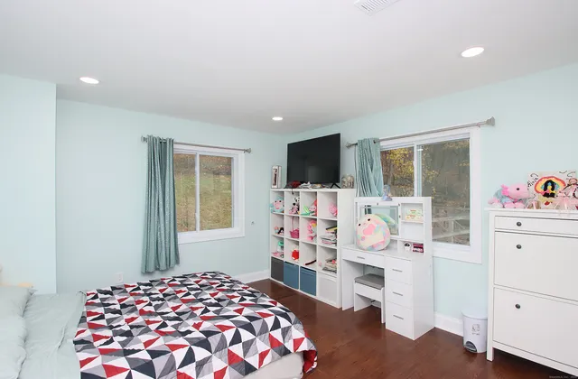 a bedroom with furniture and a bed