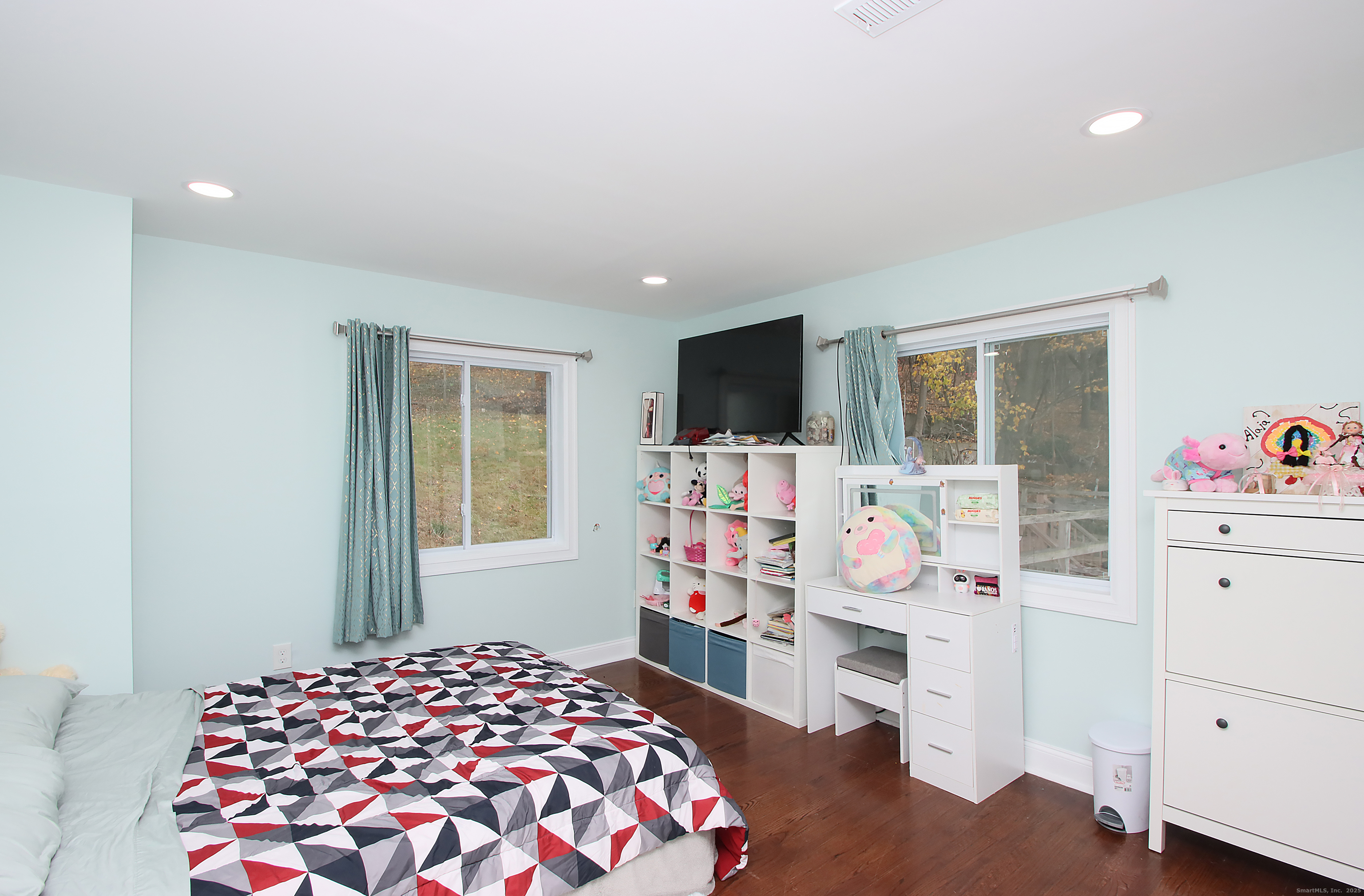 32 Spring Street Ansonia, CT 06401 - Photo 17 of 34 a bedroom with a bed and wooden floor