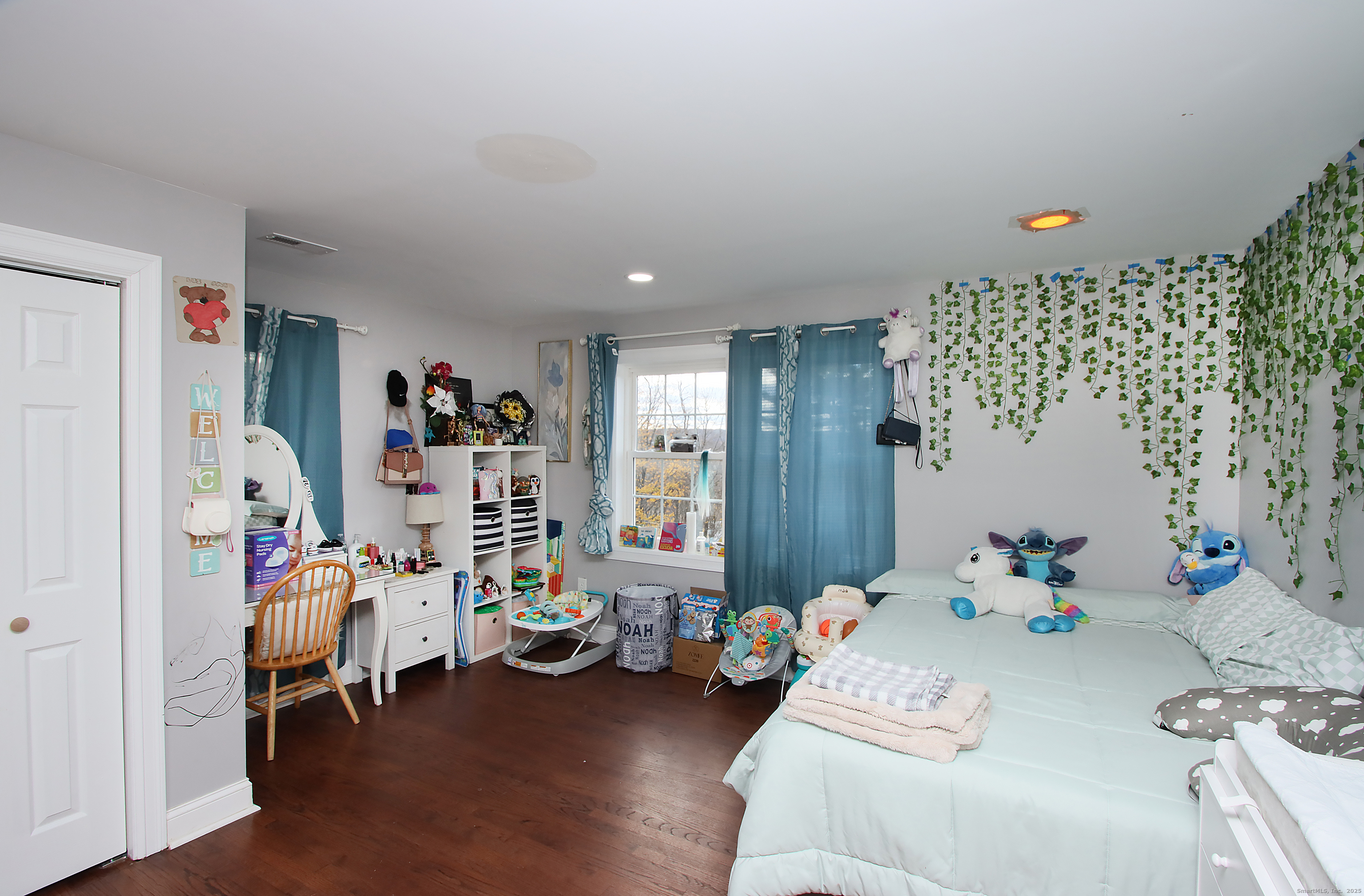 32 Spring Street Ansonia, CT 06401 - Photo 19 of 34 a bedroom with furniture and a bed