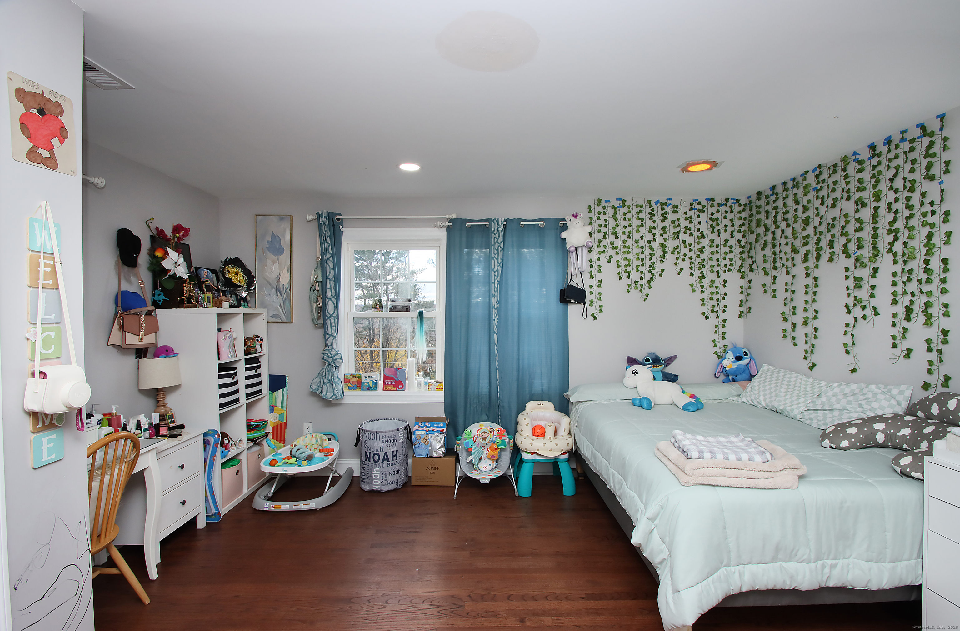 32 Spring Street Ansonia, CT 06401 - Photo 20 of 34 a bedroom with a bed and a couch