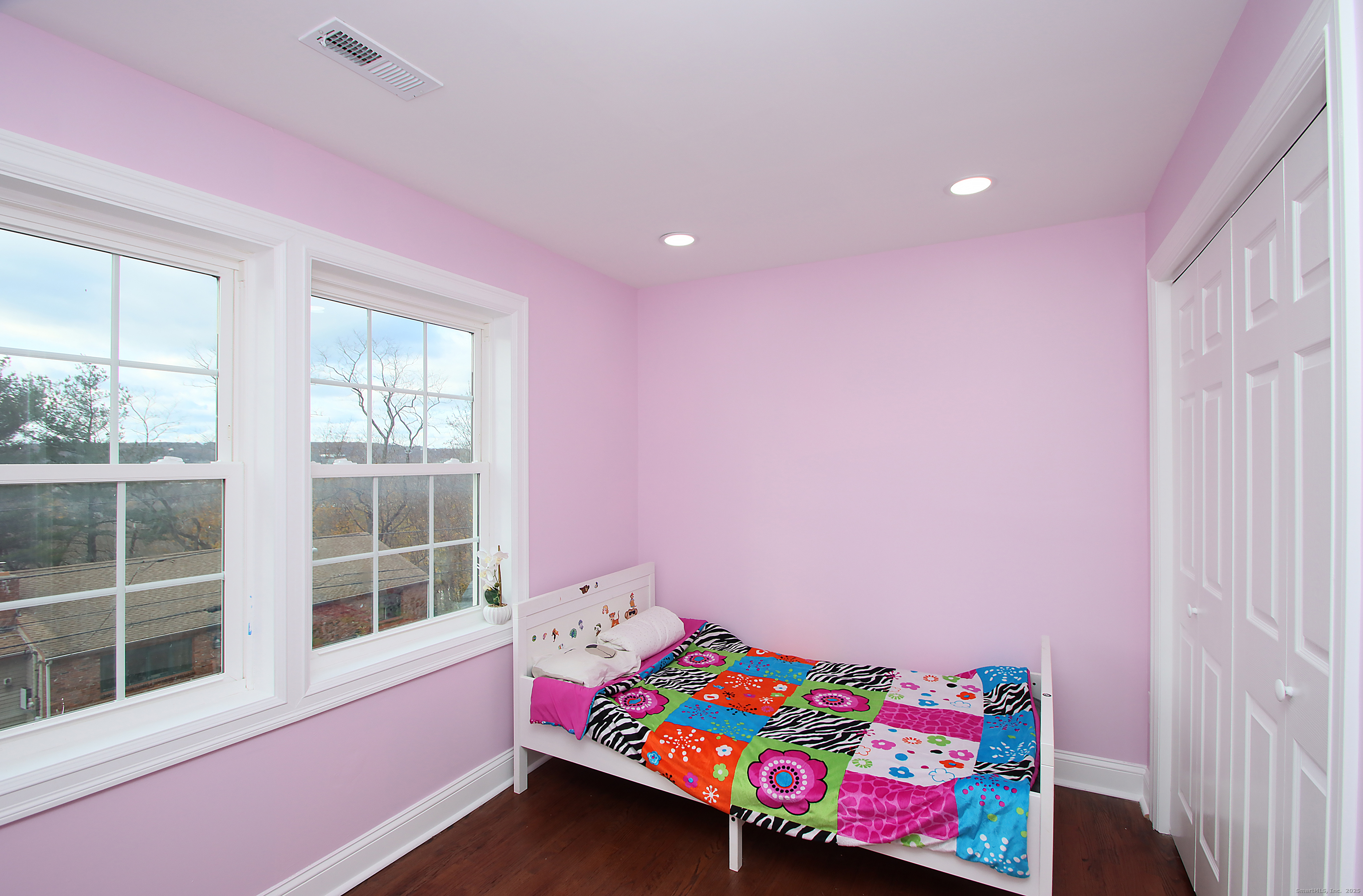 32 Spring Street Ansonia, CT 06401 - Photo 21 of 34 a bedroom with a bed and a window