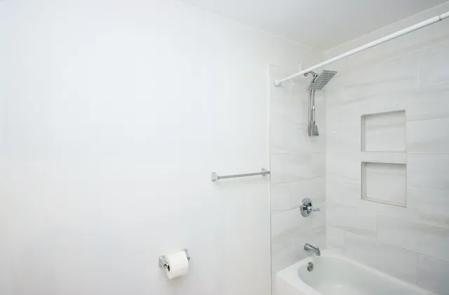 a bedroom with furniture and a flat screen tv