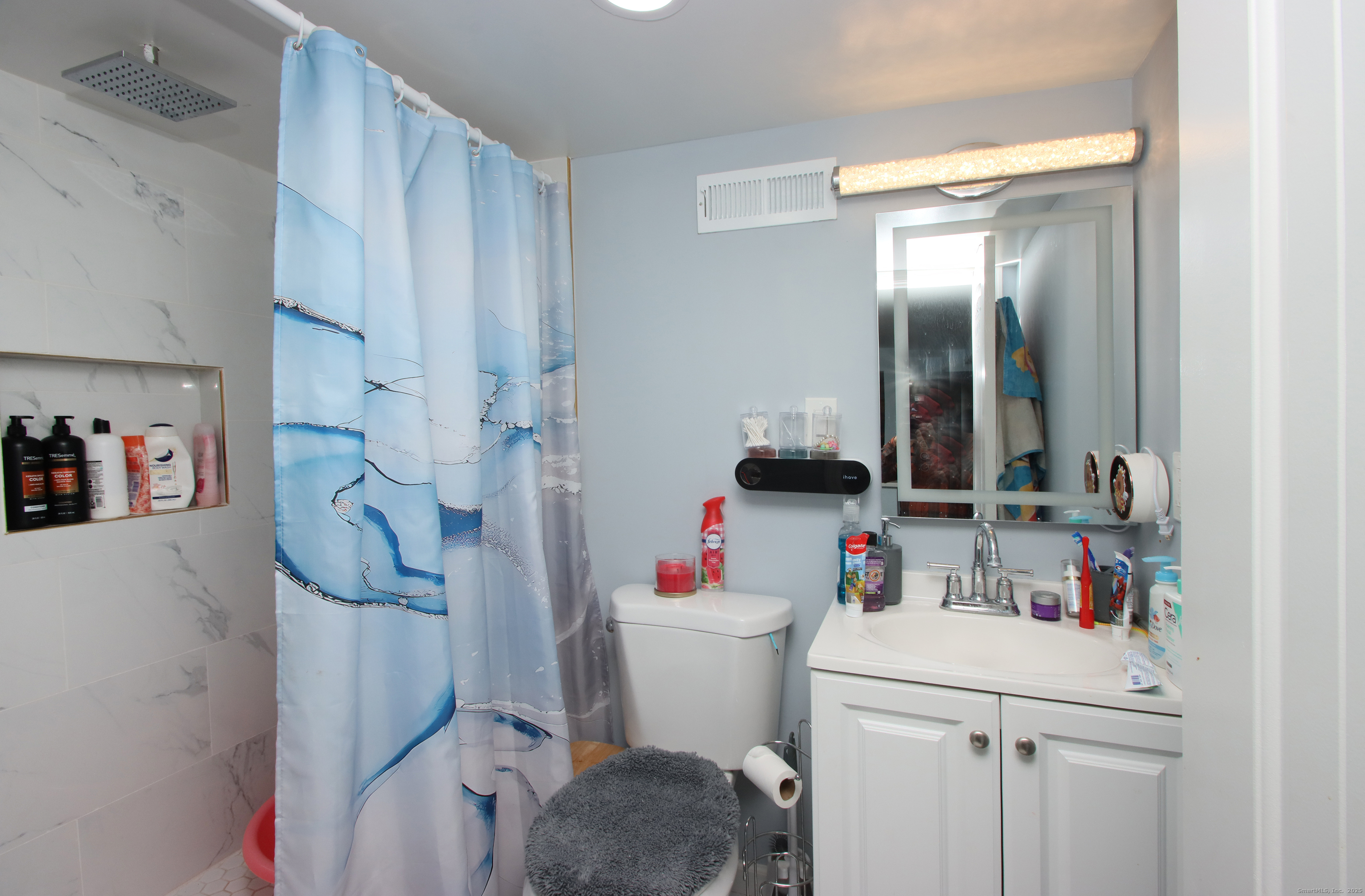 32 Spring Street Ansonia, CT 06401 - Photo 27 of 34 a white toilet sitting next to a bathroom sink