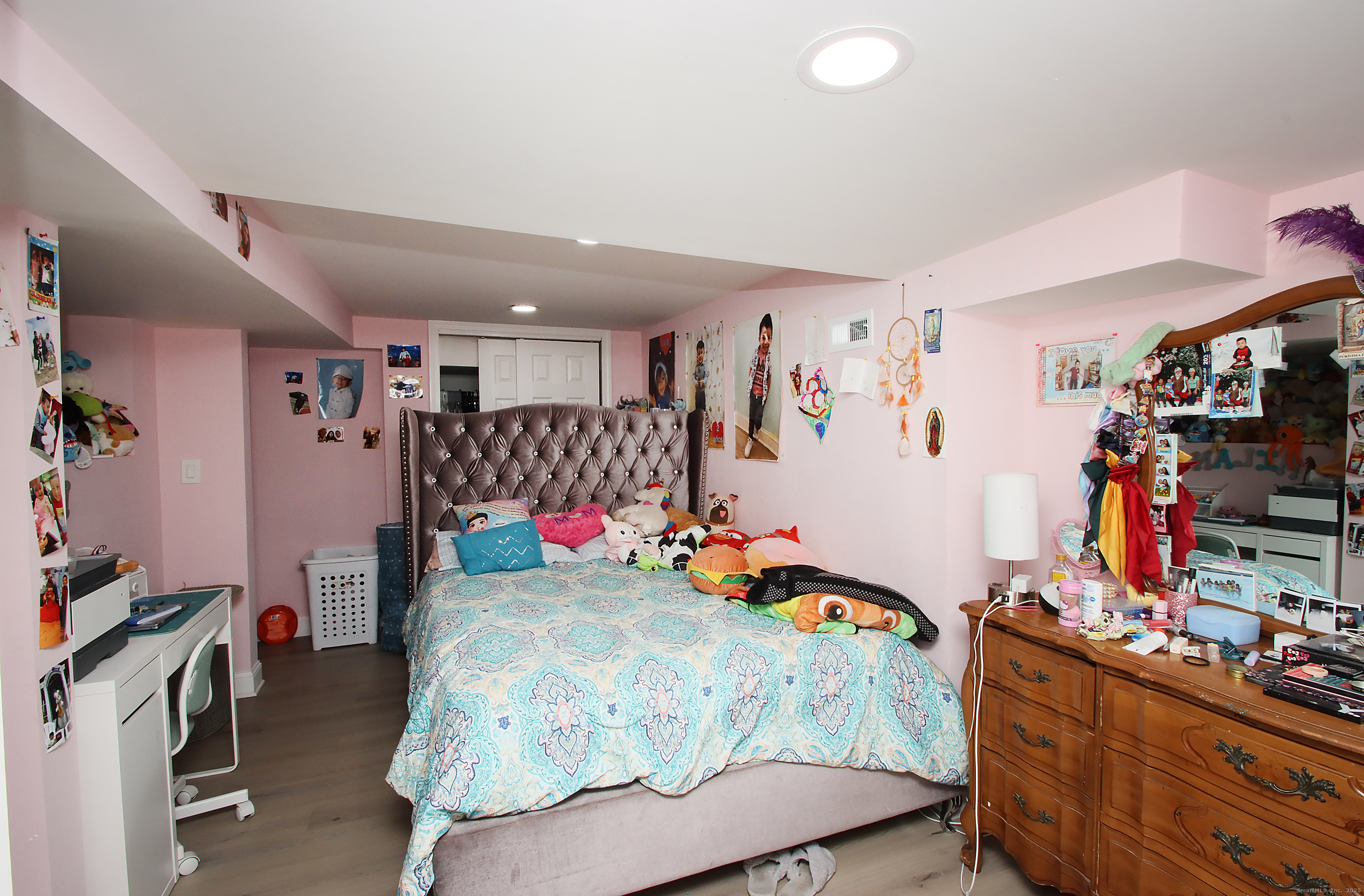 32 Spring Street Ansonia, CT 06401 - Photo 28 of 34 a bedroom with furniture and a flat screen tv