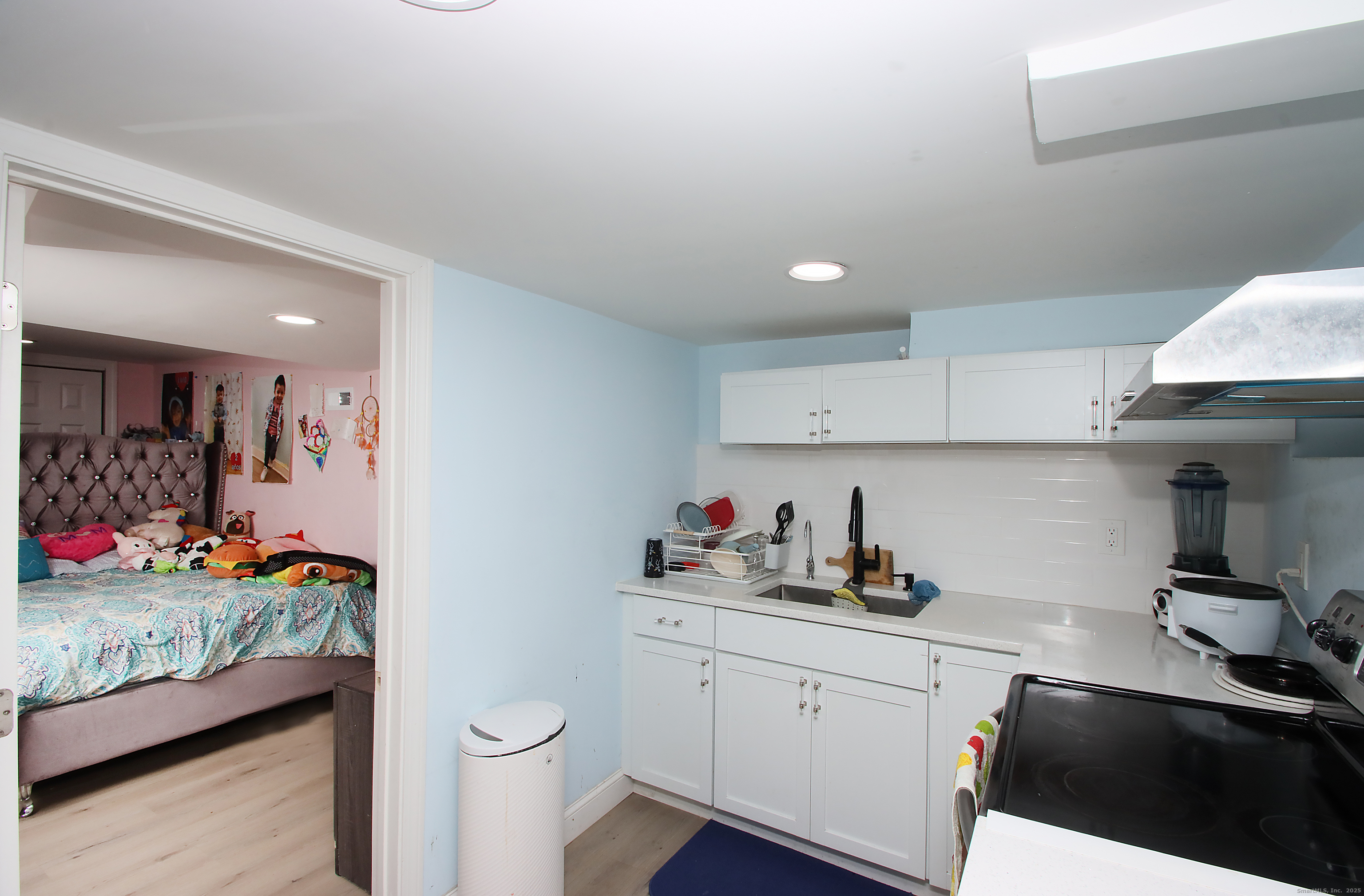 32 Spring Street Ansonia, CT 06401 - Photo 29 of 34 a kitchen with a sink and cabinets