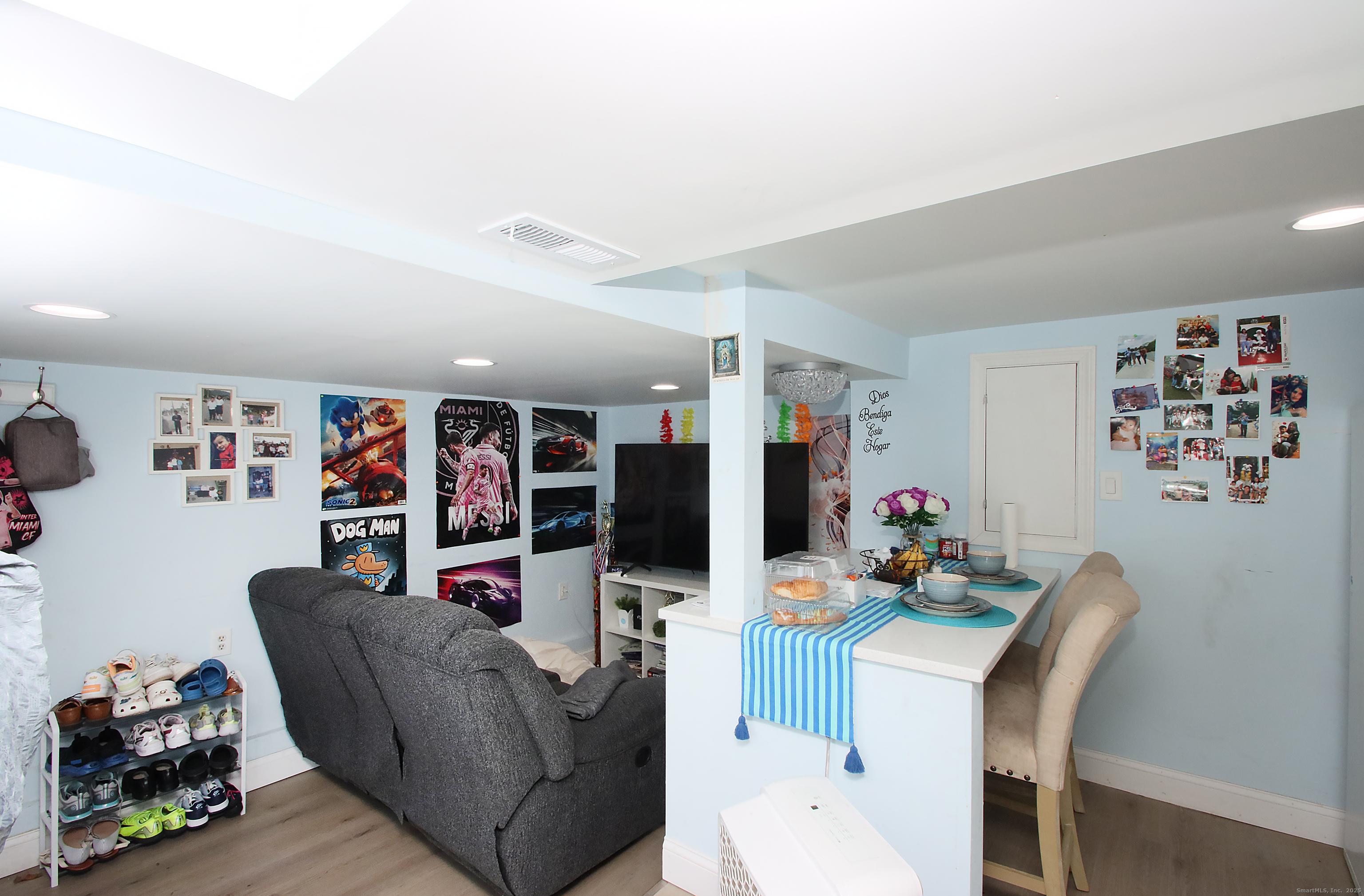32 Spring Street Ansonia, CT 06401 - Photo 31 of 34 a living room with furniture and a flat screen tv