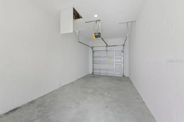 an empty room with closet and racks