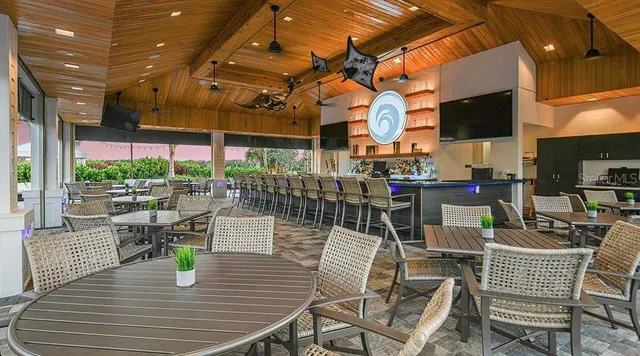 a view of a patio with dining table and chairs