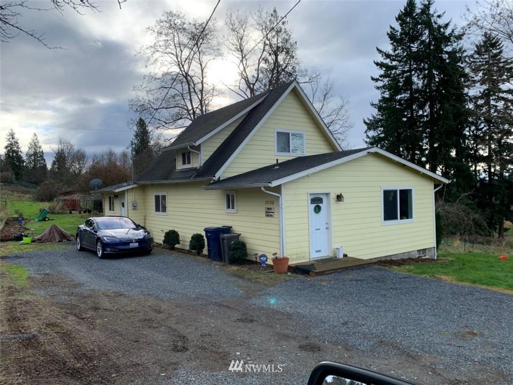 17122 Trombley Road Snohomish, WA 98290 - Photo 1 of 1 a view of garage and a car parked in front of it