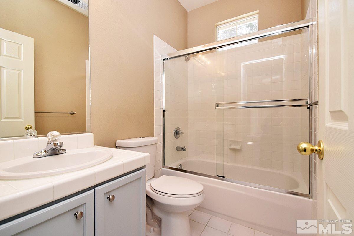 1100 Scenic Park Terrace Reno, NV 89521 - Photo 16 of 34 a bathroom with a sink a toilet and shower