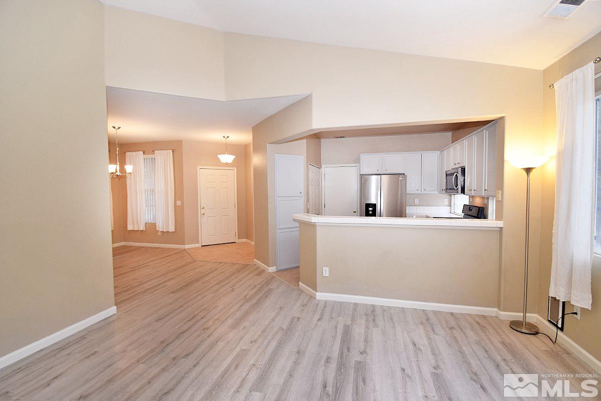 1100 Scenic Park Terrace Reno, NV 89521 - Photo 4 of 34 a view of a kitchen and a sink with wooden floor