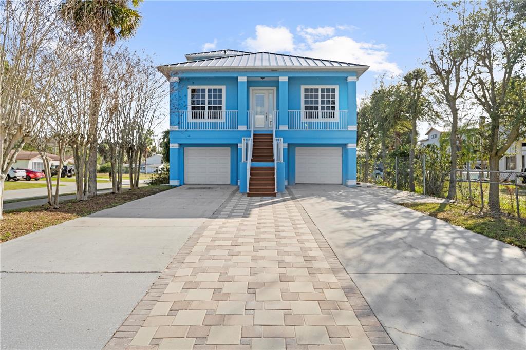 5446 Bluepoint Drive Port Richey, FL 34668 - Photo 12 of 68 a front view of a house with a yard