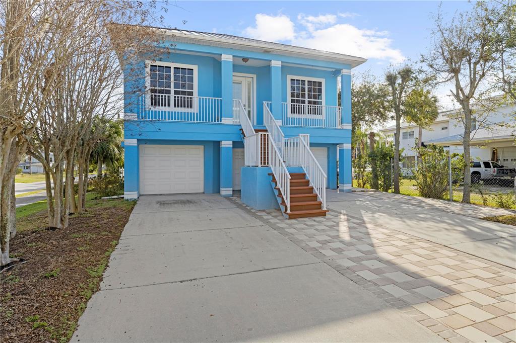 5446 Bluepoint Drive Port Richey, FL 34668 - Photo 13 of 68 front view of a house with a yard