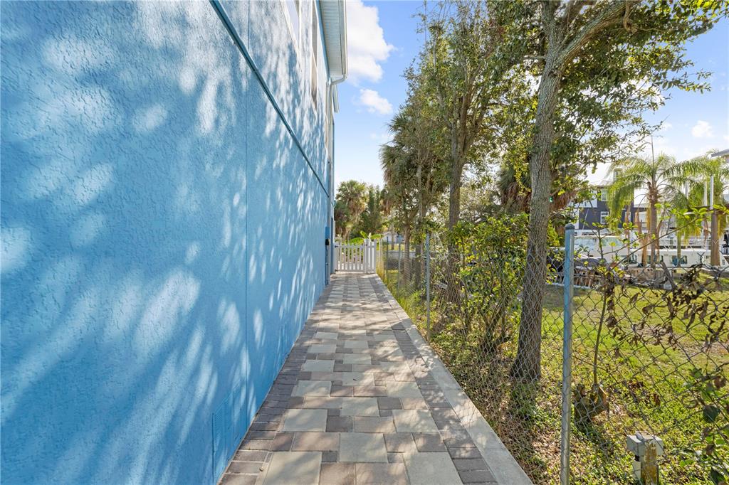 5446 Bluepoint Drive Port Richey, FL 34668 - Photo 14 of 68 a view of a pathway both side of house
