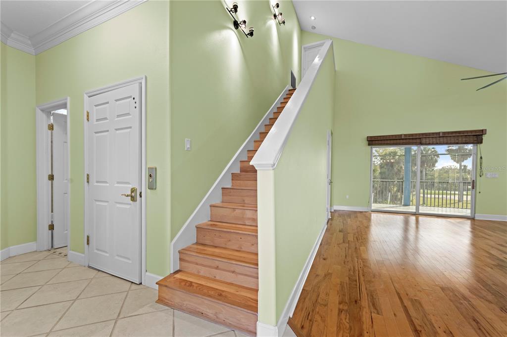 5446 Bluepoint Drive Port Richey, FL 34668 - Photo 29 of 68 a view of an entryway with wooden floor