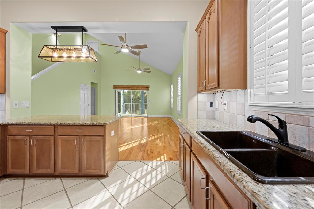 5446 Bluepoint Drive Port Richey, FL 34668 - Photo 42 of 68 a kitchen with a sink and cabinets